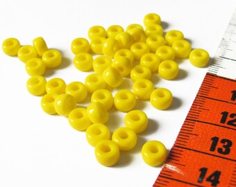 Set of 46 opaque 6mm x 4mm glass yellow pony beads
