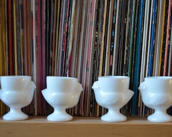 Set of 4 vintage French pressed glass egg cups with chickens in white