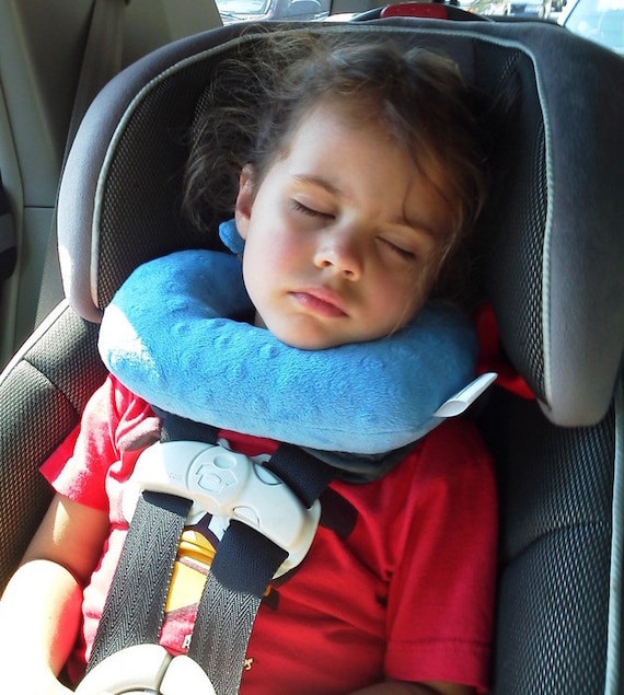 A travel pillow for children in forward facing car seats that A travel pillow for children in forward facing car seats that
