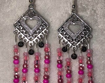 Long pink heart centered dangle earrings