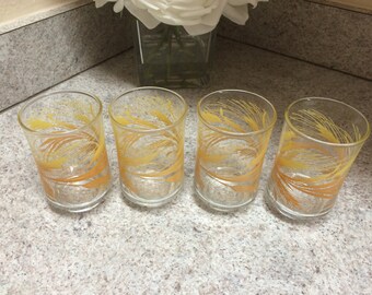 Vintage set of 4 matching juice glasses. Yellow and orange wheat pattern.