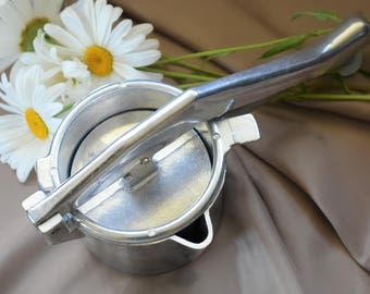 Italian vintage citrus press, three piece moulded aluminium