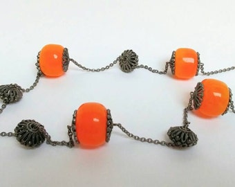 Long vintage faux amber hippie necklace.