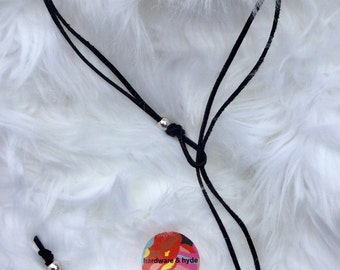 Black leather silver tone hardware lariat style necklace