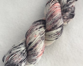 Sybil // black, red, and pink speckles on a natural white background