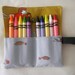 Crayon wallet/crayon holder for 10 crayons in fabric by Moda entitled "Little Apples".