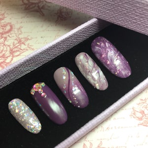 Purple shades gel polish. matte and high gloss gels. Ombre, Marble design, glitter, gems & holographic glitter.