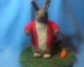 Needle felted wool bunny on felted wool grass