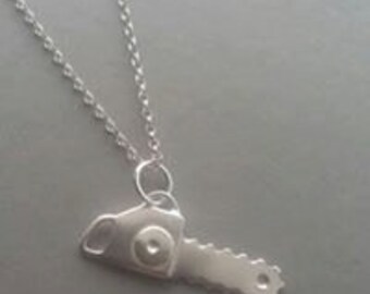 Handmade Sterling Silver horror inspired chainsaw pendant