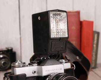 Vintage flash camera, Flash Norma Fil-46, Impulse flash, Professional photos subject, Photography flash, Vintage flashing charging 220V