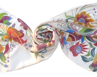 Silk scarf in folk art style with floral motifs on white silk. Hand painted silk scarf, decorative paintings. Soft silk scarf