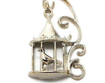 With silver metal bird cage charm