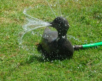 Vintage, rare, and adorable WORKING metal duck water sprinkler