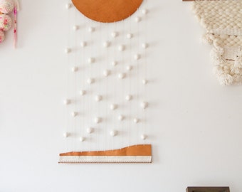 Wall hanging - leather and clay - down up - by Soledad Proaño