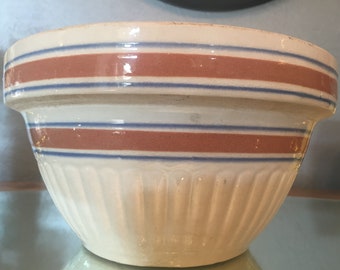 Vintage Yellow Ware Farmhouse Mixing Batter Bowl with Orange and Blue Stripes.