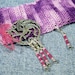 Moveable stitch markers, perfect for thread crochet or fine yarn projects, 4 pink beaded markers and a dragon holder