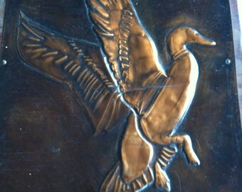 Handmade copper duck repousse