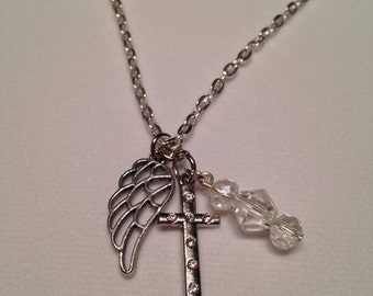 Grey wing and cross necklace