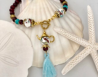 Blue flower teapot tassel bracelet with toggle closure