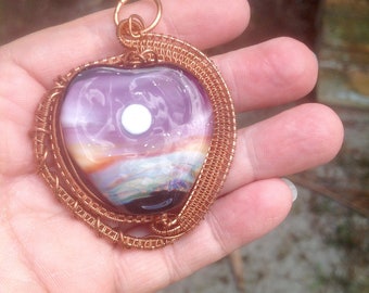 Wire wrapped heart shaped glass pendant