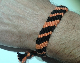 Orange and black Friendship Bracelet adjustable.