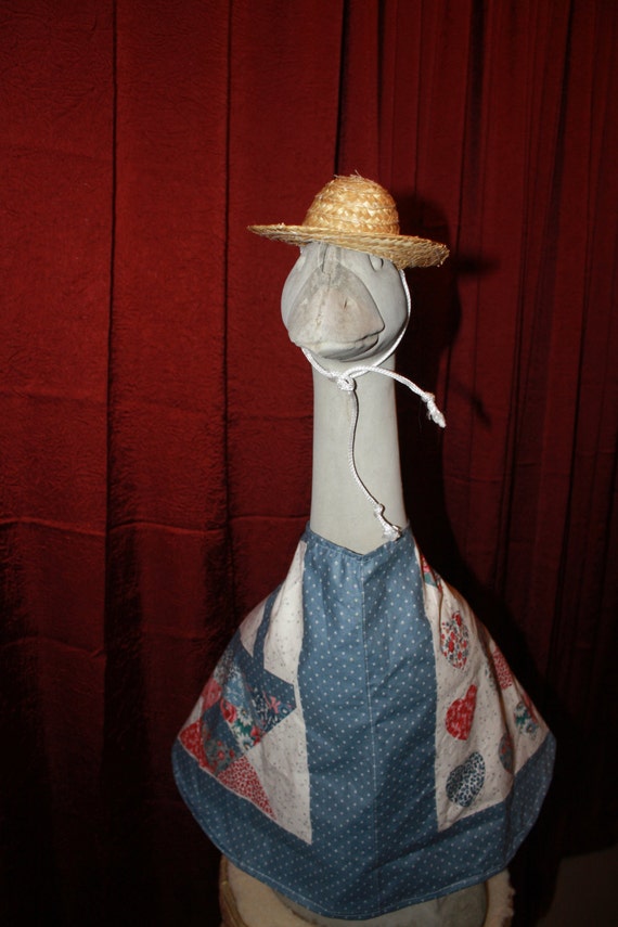 Large concrete goose outfit with hat country