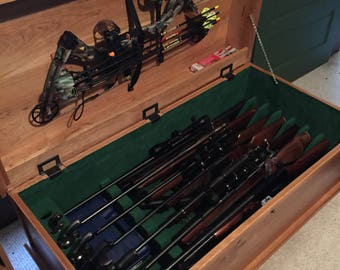 Gun Chest/Coffee Table that holds eight rifles, seven pistols and a bow in the lid.