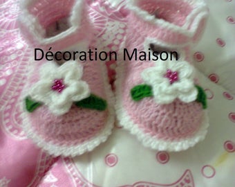 Pink baby shoe with white crochet flower