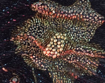 Section of a 1920s black beaded dress