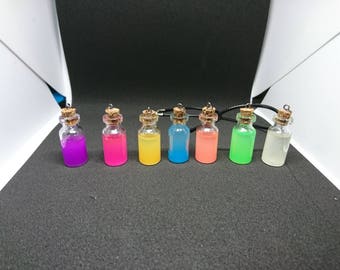 Vial necklace glows in the dark (recharges in the light)