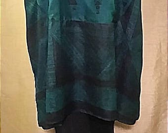 One-of-a-kind 100% up-cycled silk beautiful emeral green ethnic themed tunic featuring over-sized cowl neck and front pocket detail