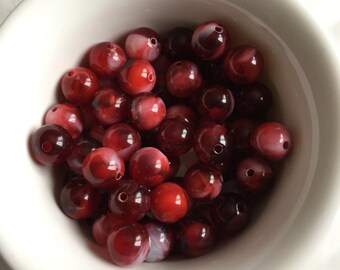 60 x red/white marble effect beads 10mm