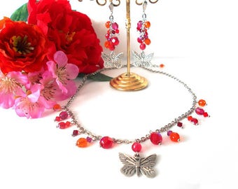 Set of butterflies and beads in shades of orange, red and fuchsia