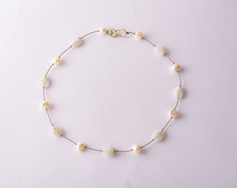 Moonstones and pearls on a string