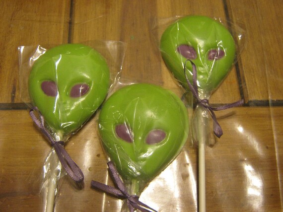 One dozen alien head chocolate lollipops