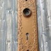 Gorgeous antique key hole door plate escutcheon in copper