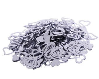 Silver heart confetti. table confetti