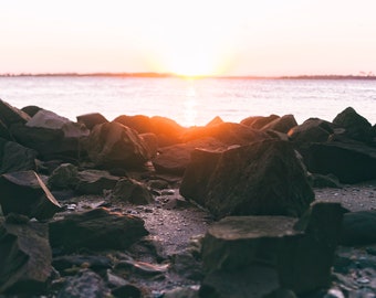 Sunset and a Rock-Covered Shore