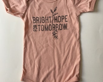 Bright Hope for Tomorrow, size 6-12 Months, Screen printed Baby one-piece, blush pink with Black print