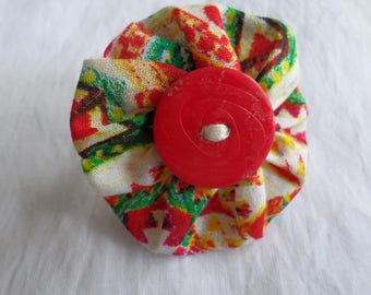 ring made with a yoyo flower and button