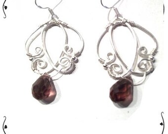 Earrings Silver 925/1000 and plum crystal.