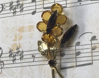 Amber and Rootbeer glass with gold tone leaves pin with "c" clasp