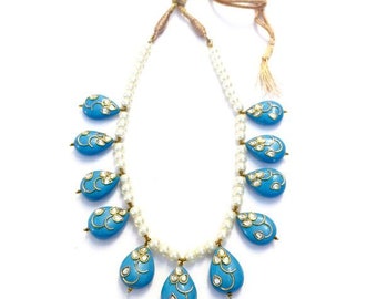 Pearls with the kundan embossed turquoise beads necklace