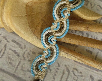 Micro macrame bracelet in waves of turquoise, white and bronze. Hemp bracelet.