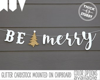 BE merry banner, with christmas tree, christmas decorations, glitter party decorations, cursive banner