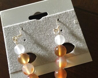 White and orange gemstones dangles earrings