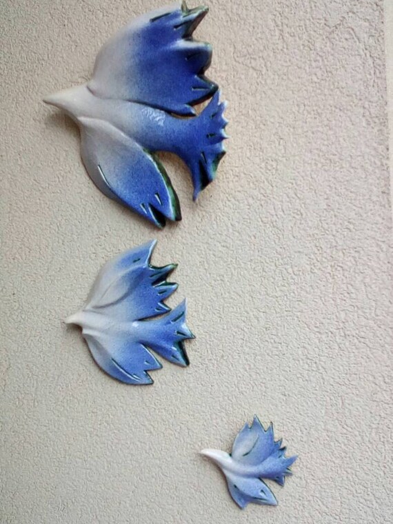Three doves . Hanging on the wall sculpture.Wall decor .Wall