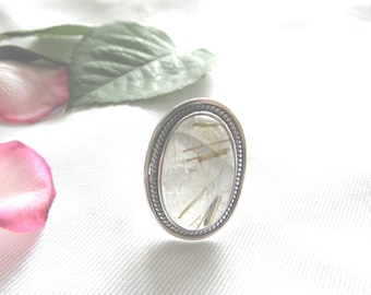 Silver ring with a rutilated Quartz stone