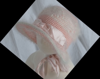 1940s, pink and angora crocheted baby bonnet with wide wired brim.