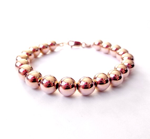 bracelet perle or rose